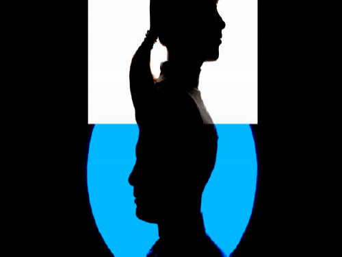 Female silhouette in white square above male silhouette in blue circle