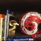 Ram football helmet on bookshelf
