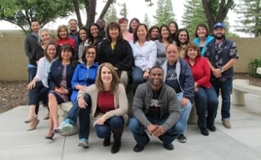 smiling fcc counselors hudled together