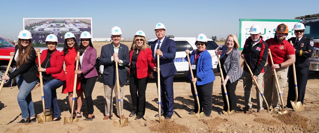 leaders in hardhats with shovels