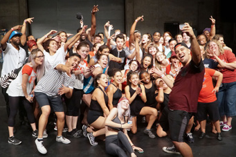 group of students posing and taking selfies