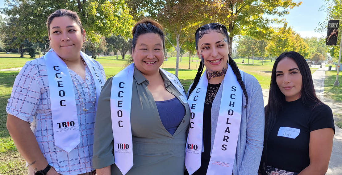 Four TRIO students standing together