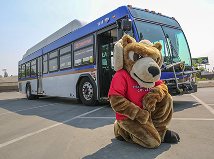 Sam the Ram in front of bus