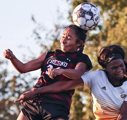 girls fighting for soccer ball