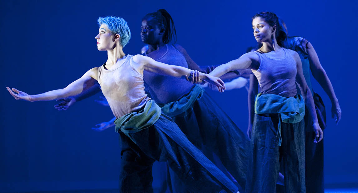 dancers in blue light