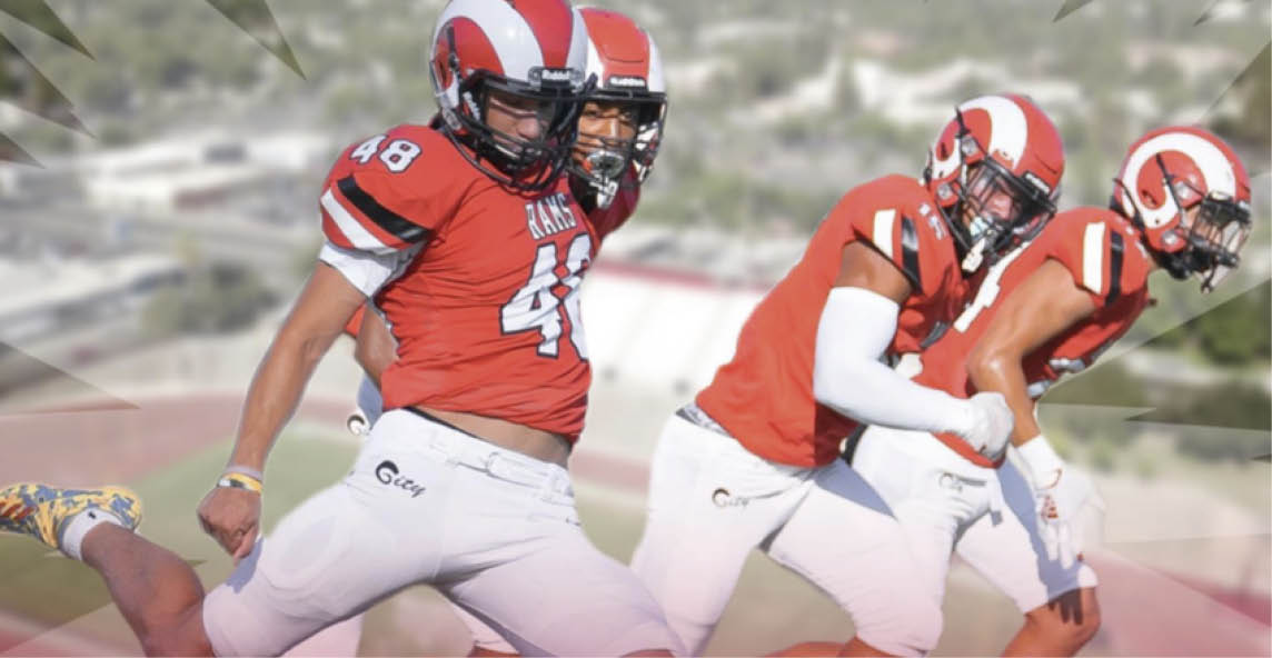 football players running down field