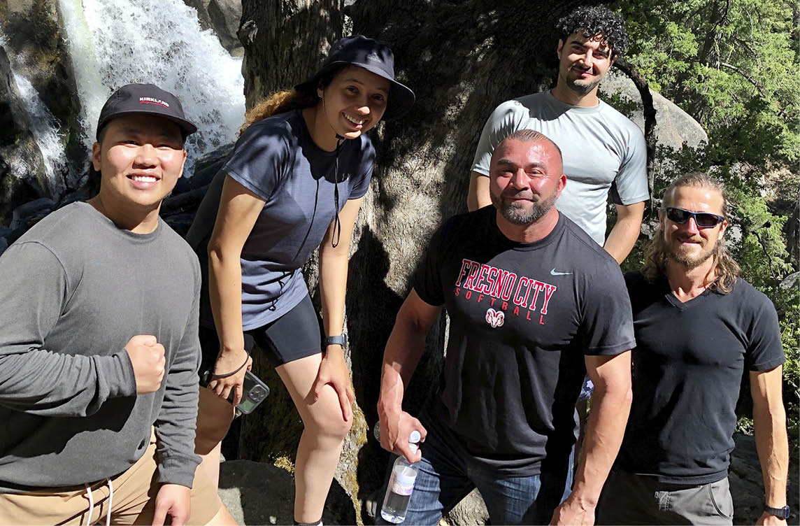 President Dr. Pimentel and students outside hiking
