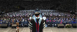 View of students at commencement gathered together in the Save Mart Center