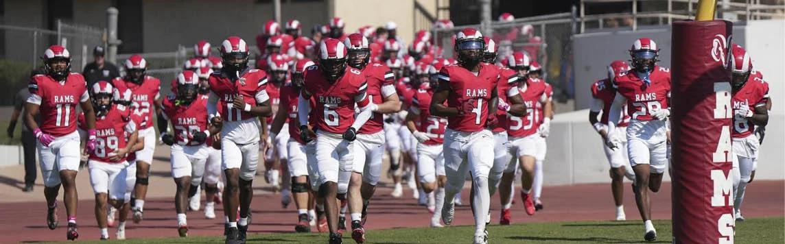 Footbal Team running on the field