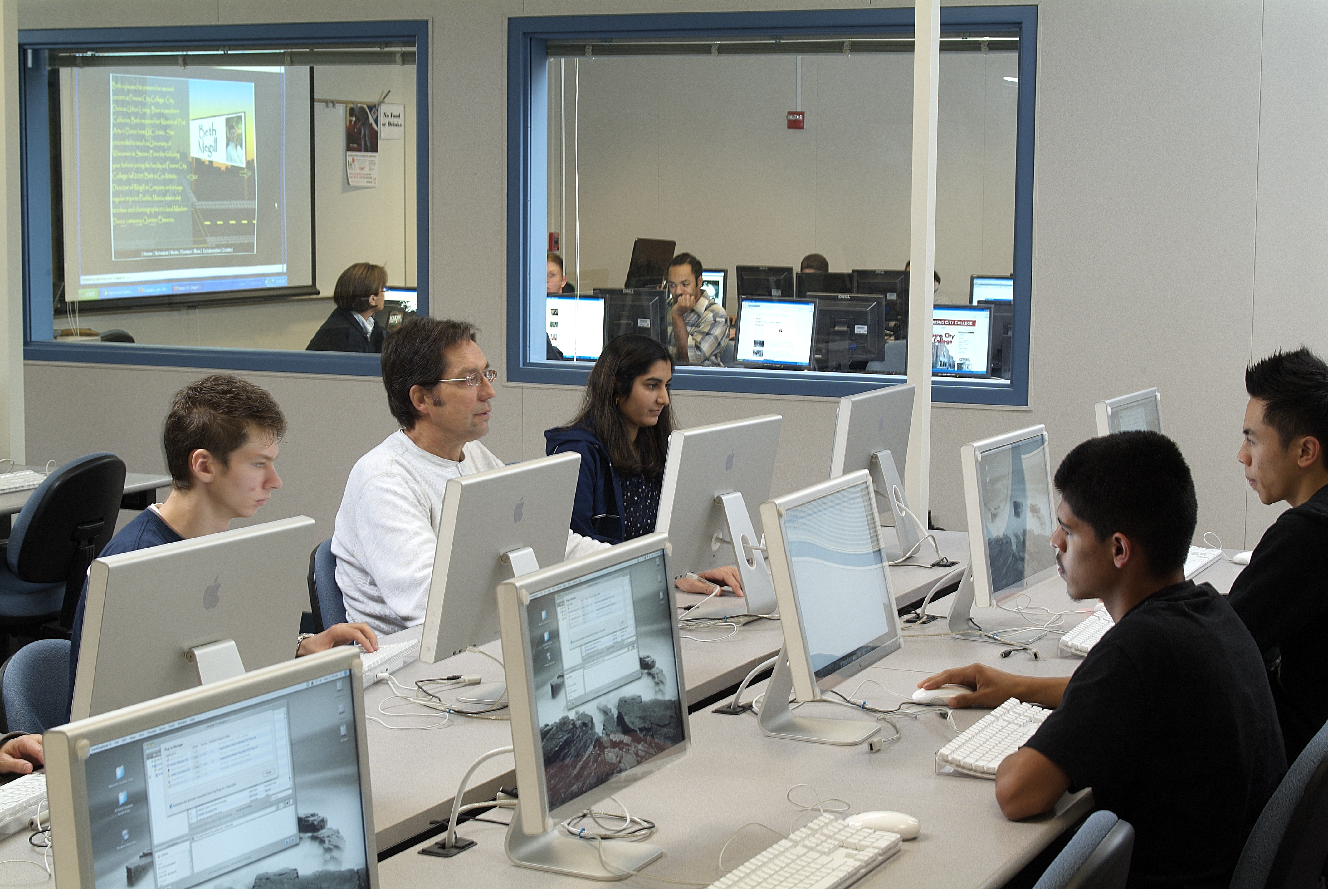      students working in the Macintosh and Windows computer labs 