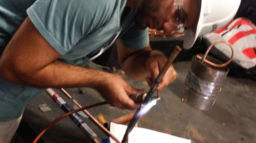      Students learn how to swage and flare copper tubing 