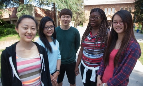 Students standing in front of a building 