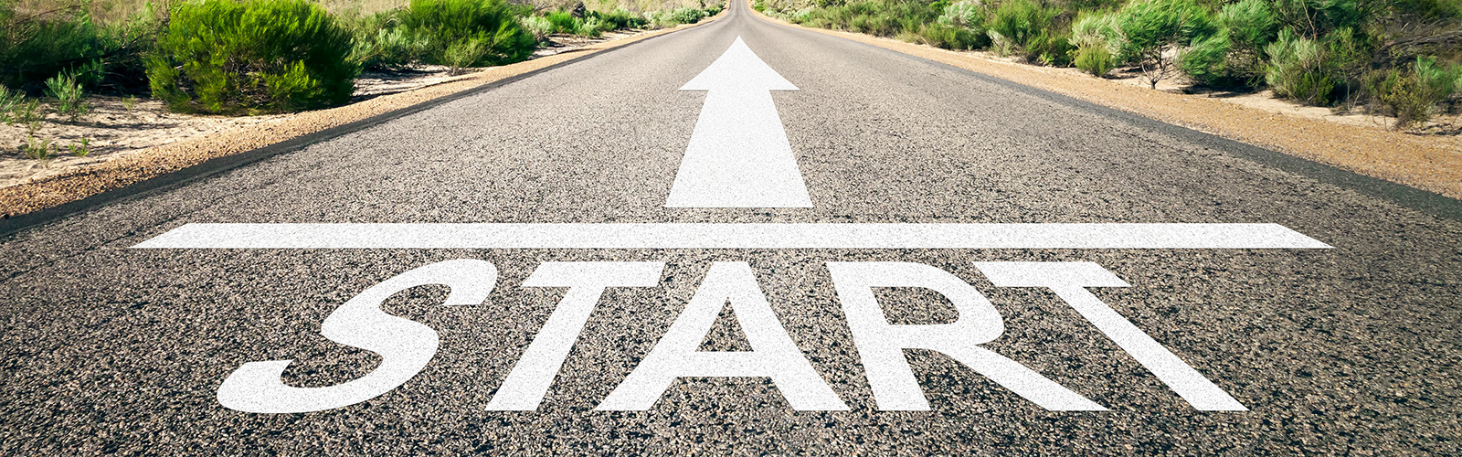 A graphic showing an asphalt road with word start written on it with white bold characters. 