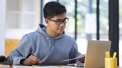 high school student working on computer