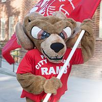 Sam the Ram holding flag