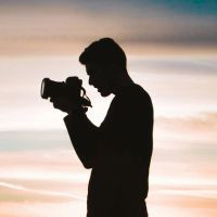 Image of a man taking a photo
