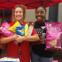 students holding food items