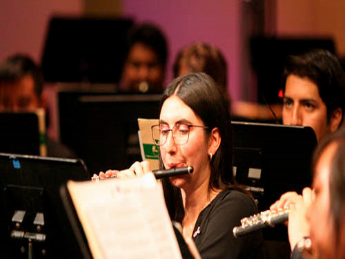 student playing flute