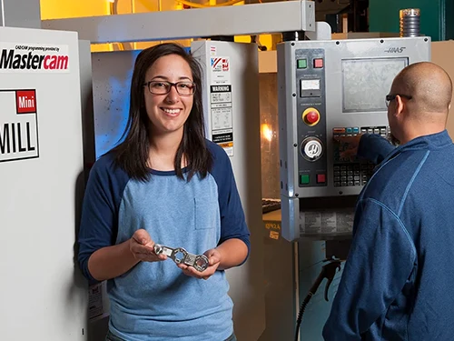 manufacturing student with machine