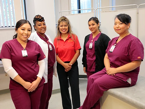 pre-allied health students in scrubs in lab