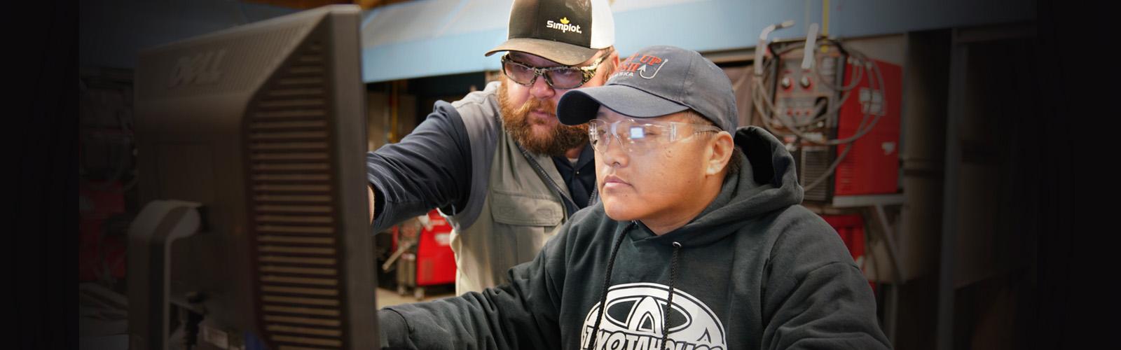 Photograph of a student and faculty in the Maintenance Mechanic Shop at CTC.