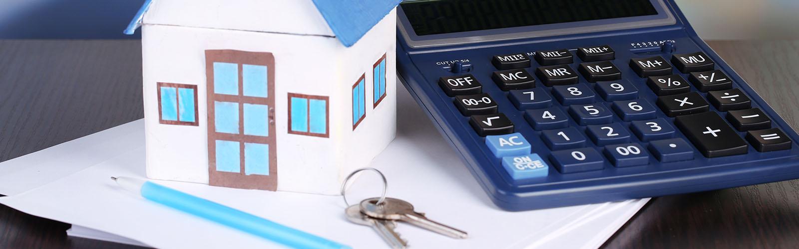 house with keys and calculator
