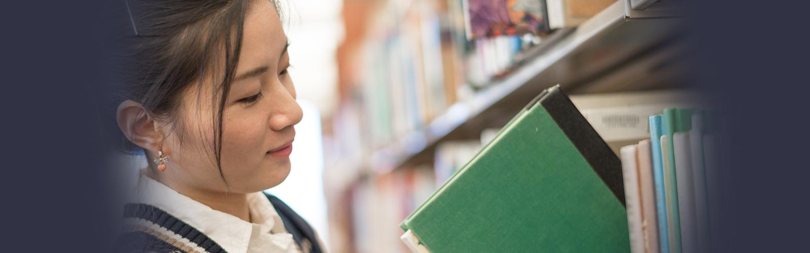 Returning student in library