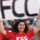 Girl at event holding sign with FCC