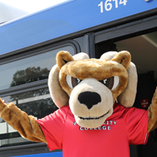 Sam the Ram in front of bus