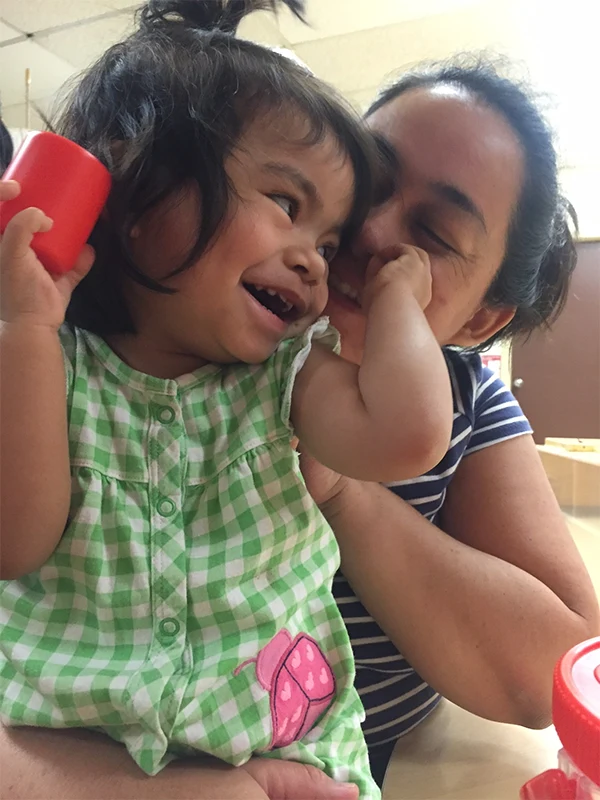 Child playing with mother in cdc
