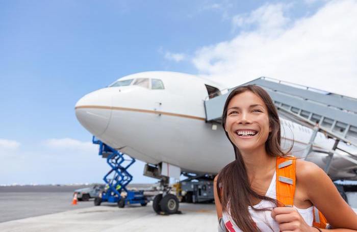 girl in front of airplane